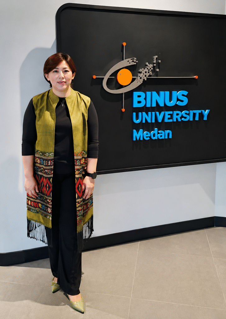 Dr. Scherly Hansopaheluwakan, S.E., M.I.B.